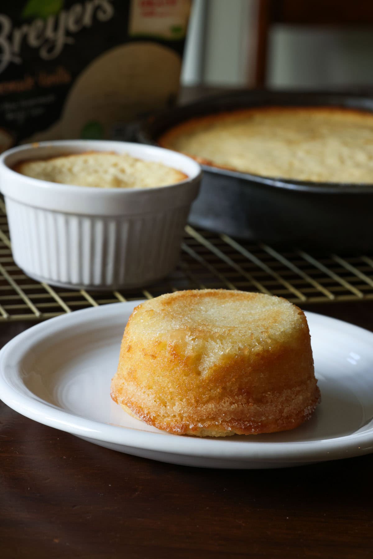 This insanely moist Copycat Butter Cake Recipe is a dupe for the Crumbl Butter Cake and the warm butter cake at California Pizza Kitchen. A warm baked cpk butter cake on a white plate