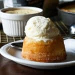 Ice cream melting on a copycat California pizza kitchen butter cake served on a white plate