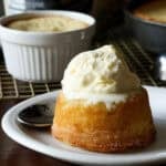 Copycat Crumbl Butter Cake topped with vanilla ice cream on a white plate
