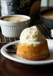 Copycat Crumbl Butter Cake topped with vanilla ice cream on a white plate