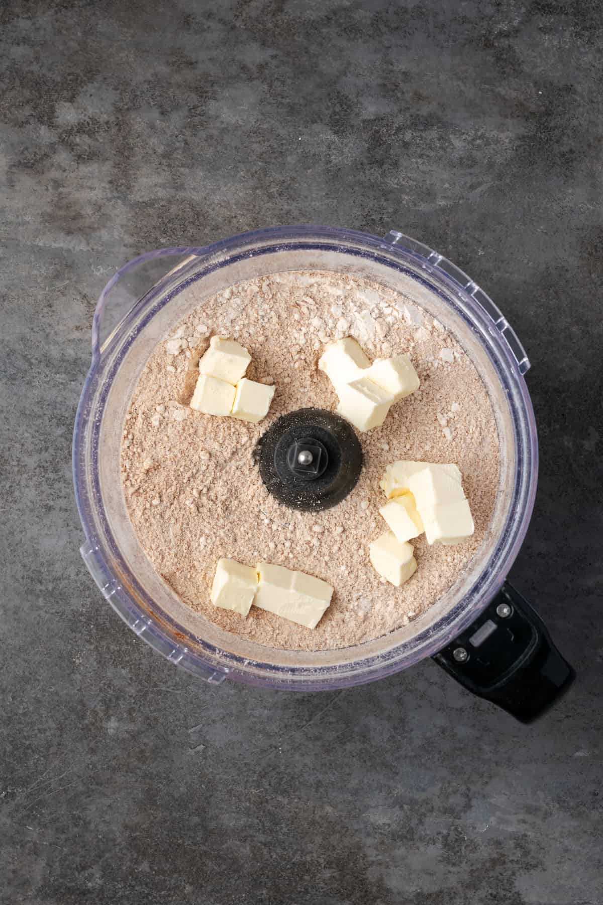 This easy apple brown betty is an old-fashioned dessert recipe with gooey baked apples layered with a buttery, sweet cinnamon crumble. Cold cubed butter added to the crumble ingredients in a food processor.