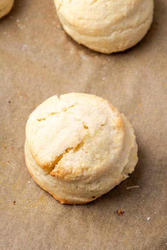 Close up of baked shortcake biscuits on a baking sheet.