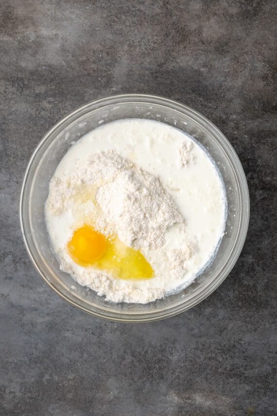 Eggs added to the butter and flour mixture in a bowl.