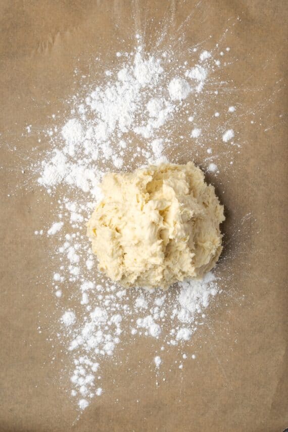 Biscuit dough turned out on a floured surface.