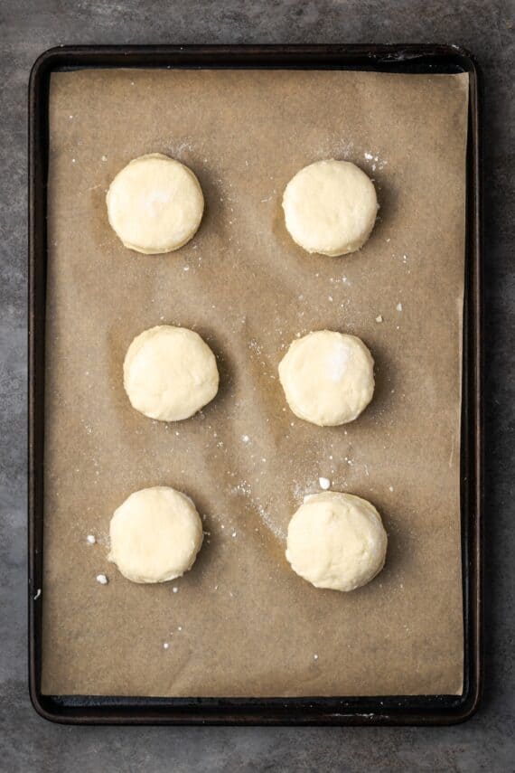Cut out biscuits on a lined baking sheet.