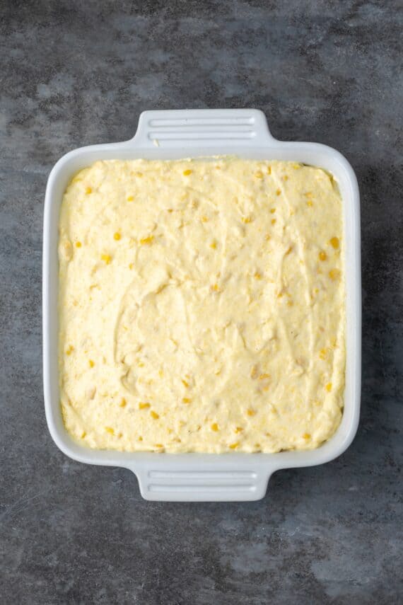 Spoon bread batter in a baking dish.