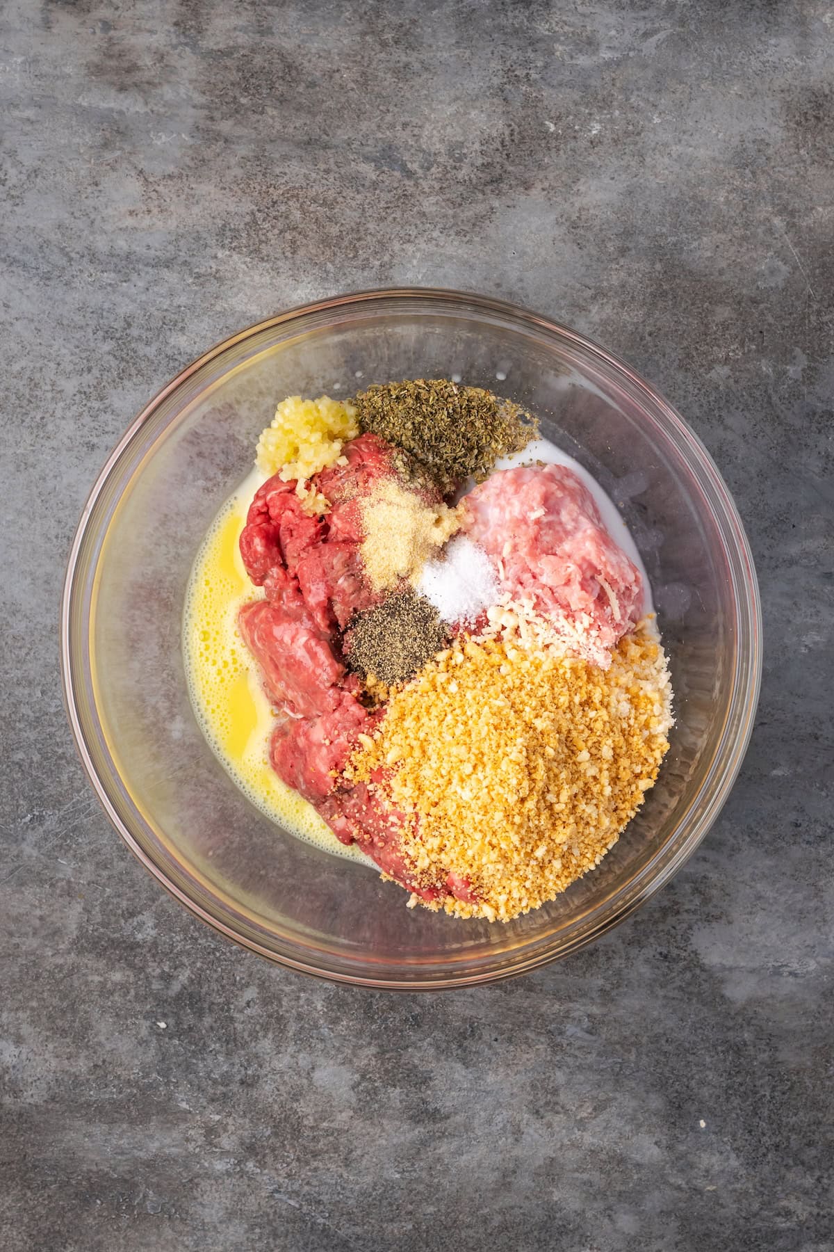 Meatball ingredients combined in a bowl.