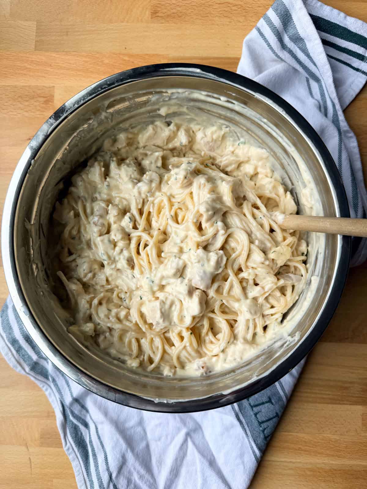 Creamy chicken tetrazzini is an easy pasta bake that's ready in under an hour! Made with juicy chicken and spaghetti in a rich cream sauce. Chicken tetrazzini mixture combined in a large bowl.