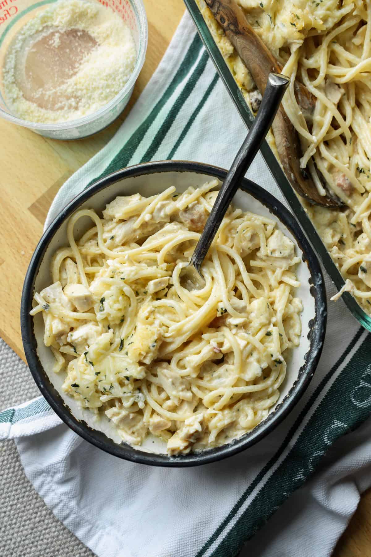 Creamy chicken tetrazzini is an easy pasta bake that's ready in under an hour! Made with juicy chicken and spaghetti in a rich cream sauce. Spaghetti noodles folded into a large bowl with cream sauce and chicken.