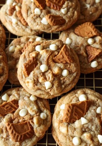 Stuffed homemade Biscoff cookies with white chocolate stacked.