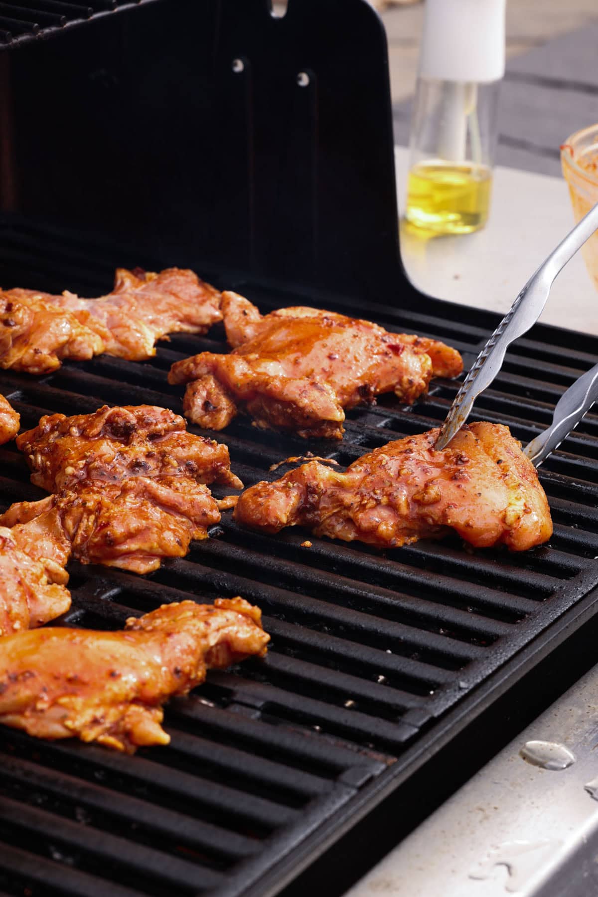 Chipotle chicken thighs on a grill.