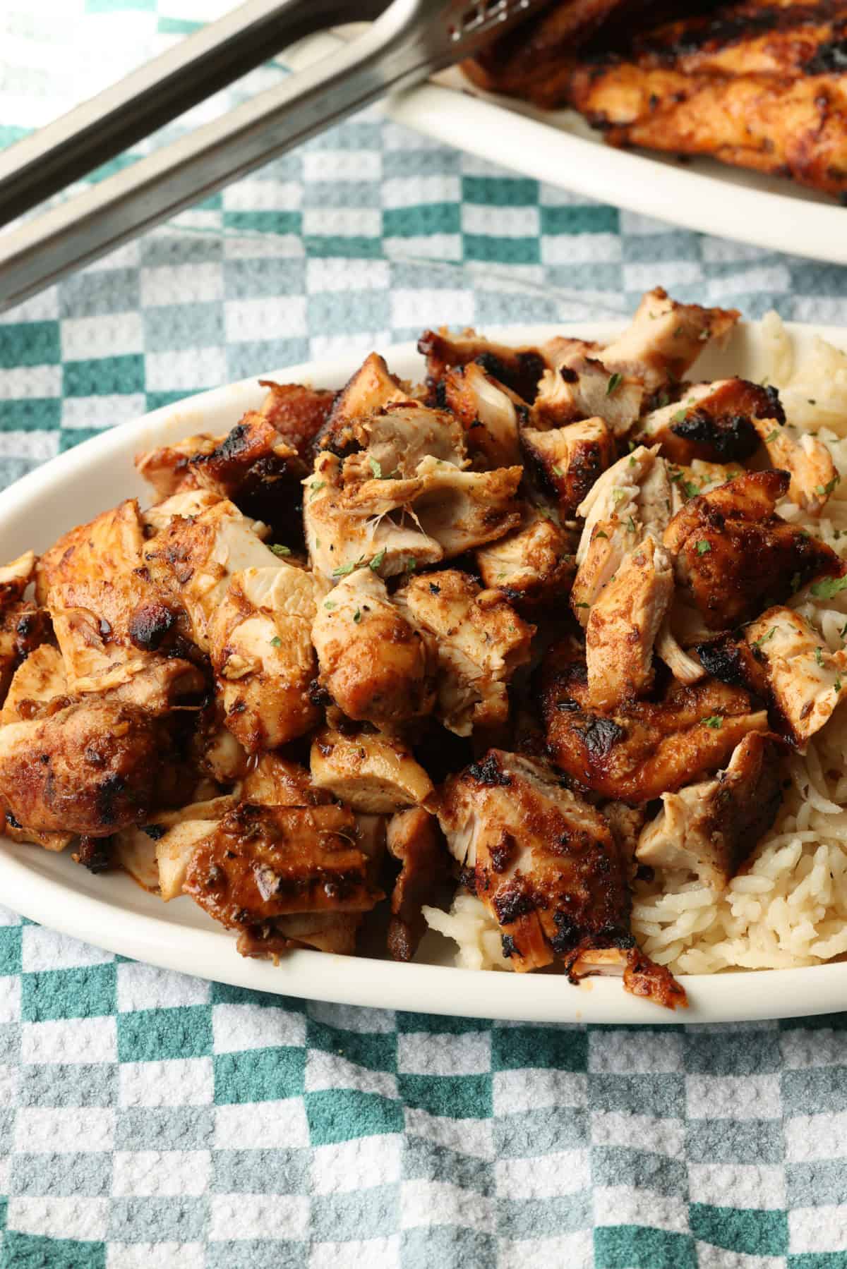Chopped Chipotle chicken served next to rice on a plate.
