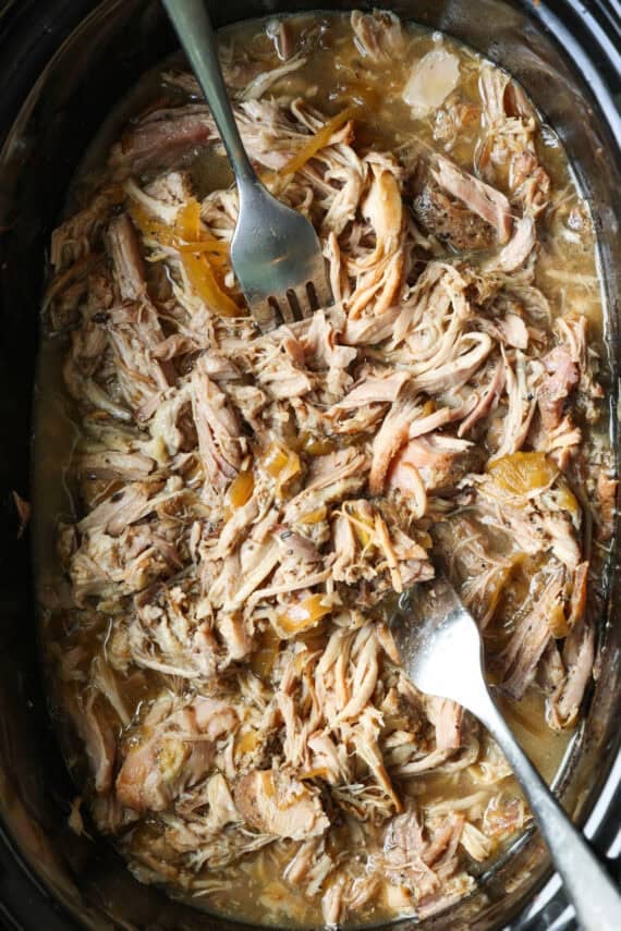 Overhead view of pulled pork inside the crock pot.