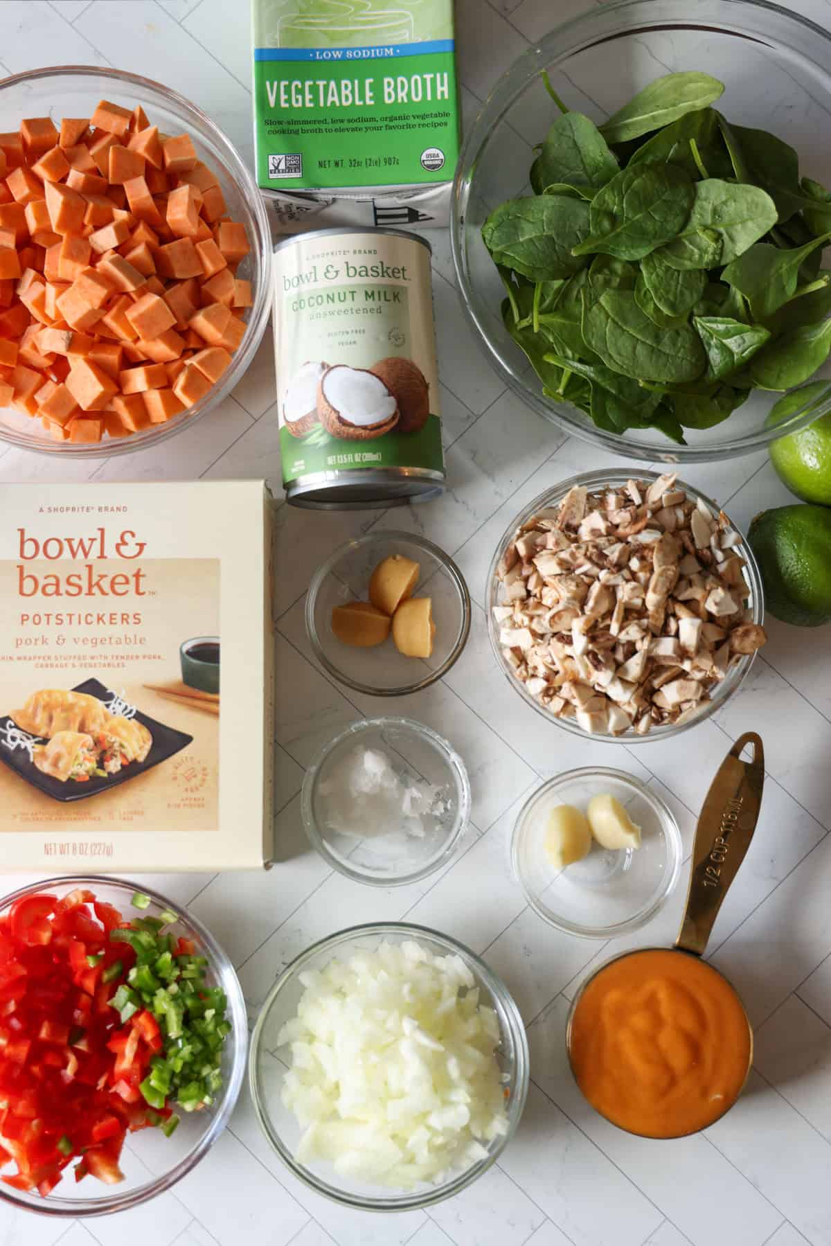 This coconut curry soup has tender Chinese potstickers swimming in a rich coconut broth with veggies. Ready in one pot in under an hour! Coconut curry potsticker soup ingredients.