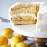 Serving a slice of lemon cake on a cake plate