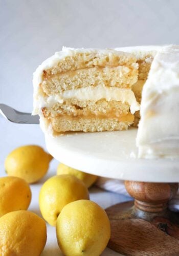Serving a slice of lemon cake on a cake plate