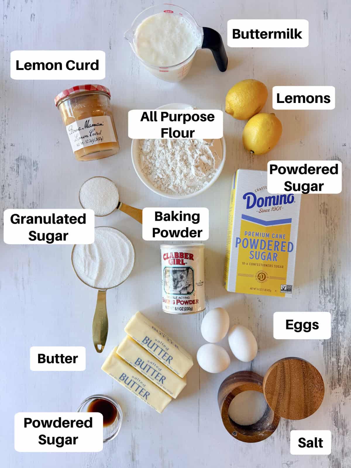 Ingredients for lemon cake laid out flat with labels