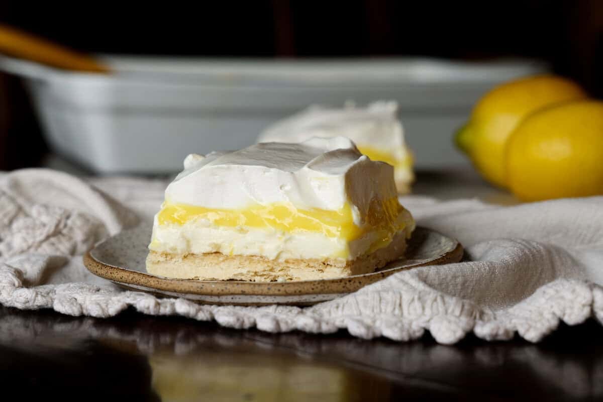Lemon Delight Pudding dessert sliced on a plate