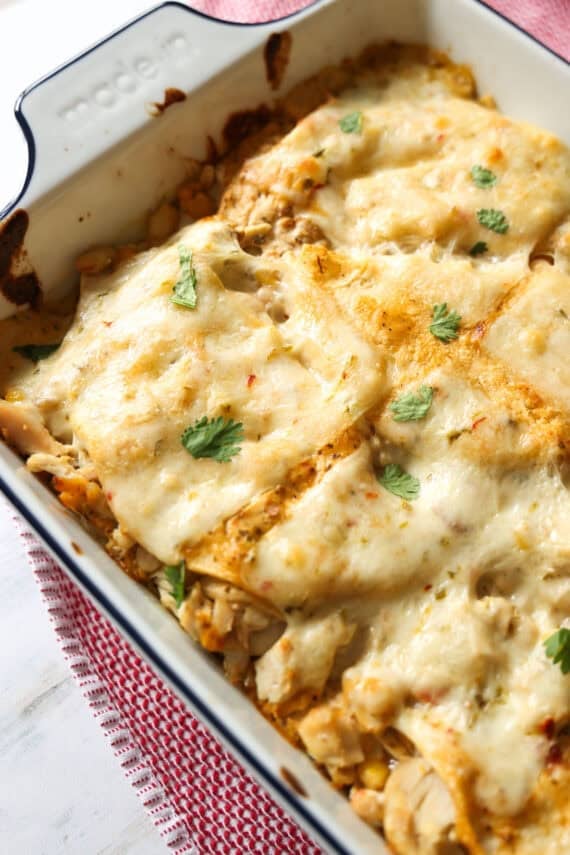 Cheesy Enchilada casserole baked garnished with cilantro.
