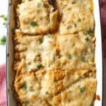 Chicken Enchilada casserole baked in a 9x13 baking dish.
