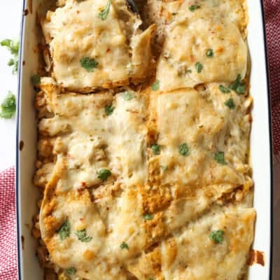 Chicken Enchilada casserole baked in a 9x13 baking dish.