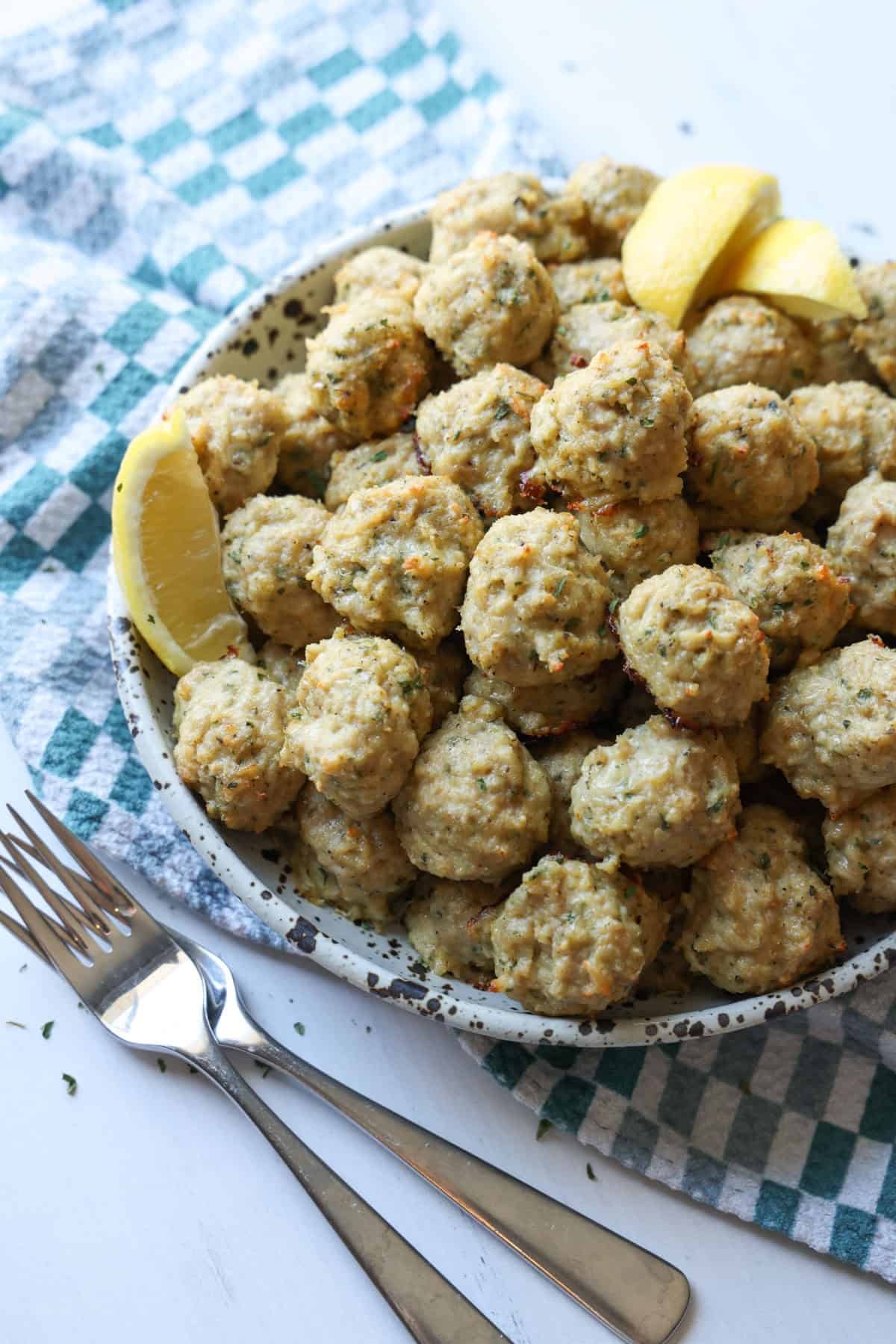 Baked meatballs in a serving bowl.