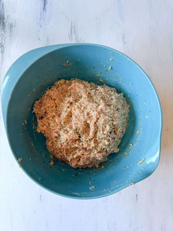 Chicken meatball mixture in a blue bowl