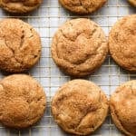 Cinnamon sugar coated churro cookies cooling on a wire rack.