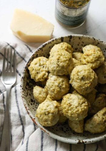 Pesto Meatballs in a stineware bowl.