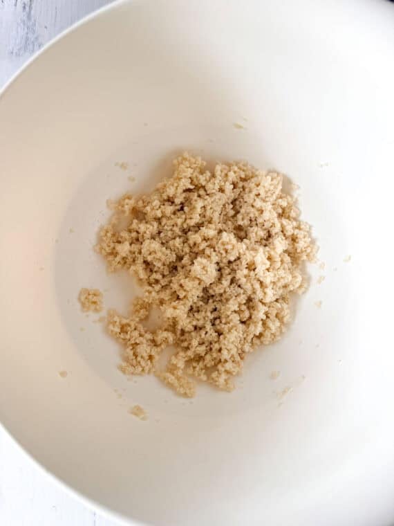 Milk soaked panko breadcrumbs in a white mixing bowl.