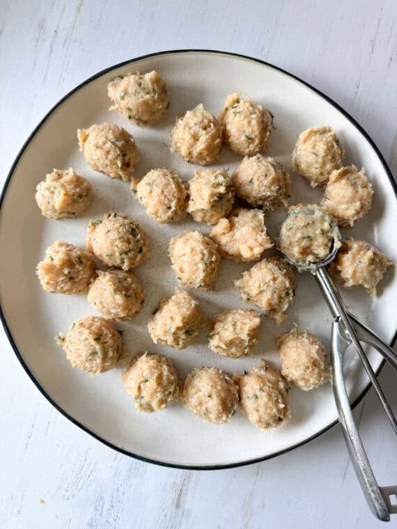Portioned out meat mixture for chicken meatballs.
