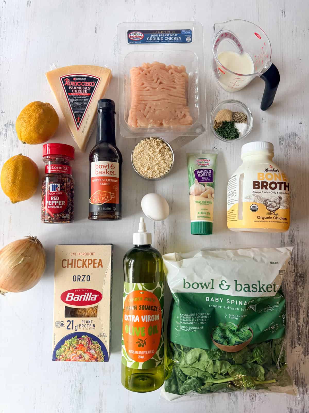 Ingredients for chicken meatballs laid out on a table