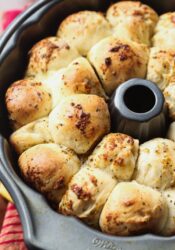 Cheesy Garlic Pull-Apart Bread is stuffed with mozzarella cheese and coated in herb butter. Crazy good as a side dish, or dipped in marinara for a meal!