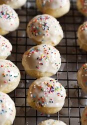 Glazed Italian Ricotta Cookies lined up on a wire rack.
