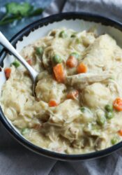 A bowl of slow cooker chicken and dumplings with shredded chicken