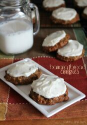 Overhead view of banana bread cookies with maple cream cheese frosting on a plate