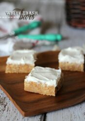 A few squares of white trash bars on a wooden board